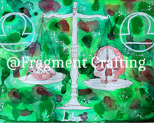 Load image into Gallery viewer, A print copy of a Libra star sign watercolour painting with various shades of green background and white set of scales with a skull one side and a heart on the other side of the scales.
