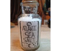 Load image into Gallery viewer, A black and white sticker of a label for Atlantic Sea Salt being showcased on a corked bottle.
