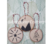 Load image into Gallery viewer, A pack of 3 wooden christmas decorations of a tree, star and mountains.
